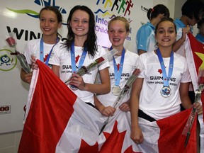 Team Windsor-Essex members Kendra Polewski, left, Zoe Mercier, Madeleine McDonald and Rachel Rode at  nternational Children's Games where they won silver in the pool, 4 x 100 relay, Friday August 16, 2013.   (NICK BRANCACCIO/The Windsor Star)