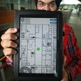 Paramvir Nagpal, 22, holds a tablet showing a UWin IPS app at the Centre for Innovation Engineering at the University of Windsor, Tuesday, Aug. 13, 2013.  (DAX MELMER/The Windsor Star)