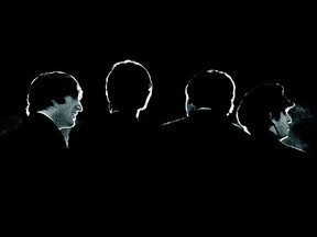 This Feb. 11, 1964 image provided by the David Anthony Fine Art gallery in Taos, N.M., shows a photograph of the Beatles taken by photographer Mike Mitchell during a news conference before the band's first live U.S. concert at the Washington Coliseum. Mitchell’s portraits of the Beatles are the centerpiece of a monthlong photography exhibition at the gallery. This marks the first time the images have been shown since their unveiling in 2011 at a Christie’s auction in New York City. (AP Photo/David Anthony Fine Art, Mike Mitchell)