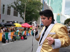 Elvis tribute artist, Norm Ackland, Jr., performs at Higgins' Harmony in Action Bash on Chatham Street East in downtown Windsor,  Sunday, Aug. 4, 2013.  The fundraiser is in honour of Jenny Higgins who died of cancer in 2012.  (DAX MELMER/The Windsor Star)