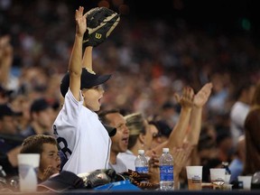 A young Tiger's fan cheers on the Detroit Tigers as they host the Kansas City Royals at Comerica Park, Saturday, August 17, 2013.  (DAX MELMER/The Windsor Star)