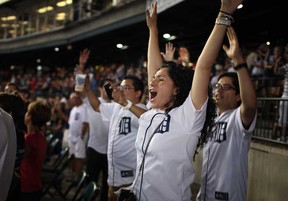 Tigers fans celebrate after Miguel Cabrera hit a walk-off home-run to beat the Kansas City Royals at Comerica Park, Saturday, August 17, 2013.  (DAX MELMER/The Windsor Star)