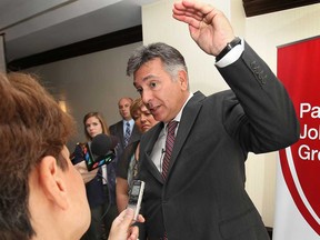 Ontario's Finance Minister Charles Sousa speaks during a media conference Monday, Aug. 26, 2013, in Windsor, Ont. (DAN JANISSE/The Windsor Star)