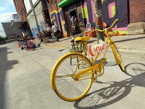 A yellow bike marks an open store in Eastern Market in Detroit on Tuesday, August 13, 2013.            (TYLER BROWNBRIDGE/The Windsor Star)
