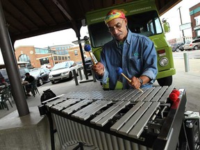 Jon Mel'O entertains shoppers in the Eastern Market in Detroit on Tuesday, August 13, 2013.            (TYLER BROWNBRIDGE/The Windsor Star)