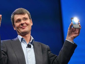 In the file photo, BlackBerry Chief Executive Officer Thorsten Heins displays the new Blackberry 10 smartphones at the BlackBerry 10 launch event at Pier 36 in Manhattan on January 30, 2013 in New York City. (Mario Tama/Getty Images)