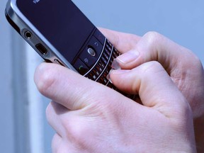 In this file photo, a text message is sent on a mobile phone. (Windsor Star files)
