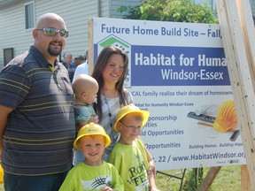 The Paquette family, back from left, Justin and Melissa, who is holding one-year-old Ethan, front from left, Noah, 6 and Nash, 4, are the recipients of the first Habitat for Humanity home built in Amherstburg. Ground was broken Wednesday on the Richmond Street lot. It is expected the home will be complete by Halloween. Julie Kotsis/The Windsor Star