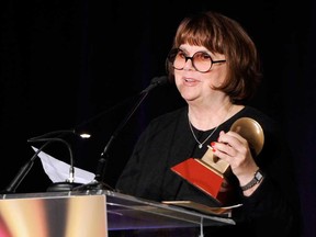 In a Nov. 9, 2011, file photo Linda Ronstadt accepts the Life Time Achievement award at the Latin Recording Academy Lifetime Achievement Award and Trustees Award ceremony  in Las Vegas.  In an AARP Magazine article posted online Friday, Aug. 23, 2013, Ronstadt says that she was diagnosed with Parkinson's disease and "can't sing a note."  (AP Photo/Chris Pizzello, file)
