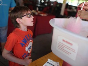 Drake Merner, 9, waits to get his hands on some cotton candy at the 9th annual Autism Ontario Windsor-Essex Summer Picnic at the Ciociaro Club, Sunday, August 25, 2013.  (DAX MELMER/The Windsor Star)