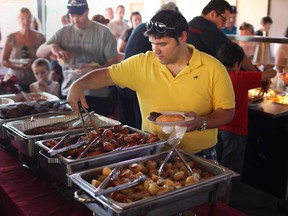 In this file photo, Luigi Congi helps himself to some lunch at the 9th annual Autism Ontario Windsor-Essex Summer Picnic at the Ciociaro Club, Sunday, August 25, 2013.  (DAX MELMER/The Windsor Star)