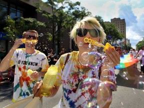 Participants make their way down Ouellette Avenue during the 2013 Pride Parade in downtown Windsor, Ontario on August 11, 2013. (JASON KRYK/The Windsor Star)