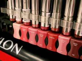 In this Aug. 3, 2006, file photo, Revlon cosmetics are on display in a New York pharmacy. Revlon announced Monday, Aug. 5, 2013, it is buying Colomer Group, which sells hair dye and other products to beauty salons, for about $660 million, saying the deal will help it reach new salon customers and could cut costs. (AP Photo/Mark Lennihan, File)