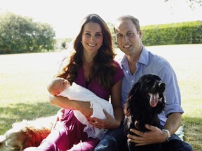 In this handout image provided by Kensington Palace, Catherine, Duchess of Cambridge and Prince William, Duke of Cambridge pose for a photograph with their son, Prince George Alexander Louis of Cambridge, surrounded by Lupo, the couple's cocker spaniel, and Tilly the retriever (a Middleton family pet) in the garden of the Middleton family home in August 2013 in Bucklebury, Berkshire. (Photo by Michael Middleton - WPA Pool/Getty Images)