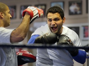 Windsor's Samir El-Mais, right, trains with coach Josh Canty at the Border City Boxing Club. (DAN JANISSE/The Windsor Star)
