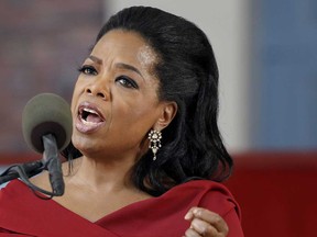 In this May 30, 2013 file photo, Oprah Winfrey speaks during Harvard University's commencement ceremonies in Cambridge, Mass. Winfrey says she had a racist encounter while shopping in Switzerland -- and the apologetic national tourist office agrees. The billionaire media mogul told the U.S. program “Entertainment Tonight” that a shop assistant in Zurich refused to show her a black handbag because it was “too expensive” for her. She was in town to attend last month’s wedding of her longtime pal Tina Turner, who lives in a Swiss chateau along Lake Zurich. Forbes magazine estimates that Winfrey earned $77 million in the year ending in June. (AP Photo/Elise Amendola, File)