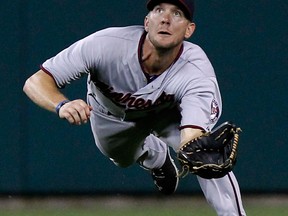 Minnesota centre-fielder Clete Thomas makes a diving catch on a fly ball hit by Torii Hunter of the Detroit Tigers in the eighth inning at Comerica Park. (Photo by Duane Burleson/Getty Images)