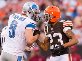 Lions quarterback Matthew Stafford, left, greets Cleveland cornerback Joe Haden during the first half of a pre-season game at FirstEnergy Stadium. (Photo by Jason Miller/Getty Images)