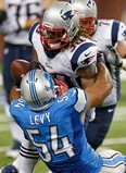 Detroit linebacker DeAndre Levy, left, forces a fumble during a run by Brandon Bolden of the New England Patriots at Ford Field Thursday. (Photo by Gregory Shamus/Getty Images)