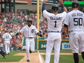 Detroit's Austin Jackson, left, celebrates after hitting a three-run homer in the sixth inning against the Minnesota Twins at Comerica Park Thursday. (Photo by Leon Halip/Getty Images)