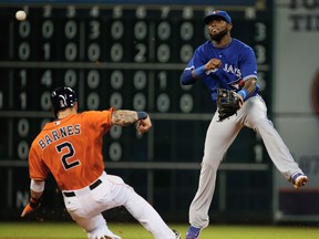 Toronto's Jose Reyes, right, makes a play at second base in the fifth inning against Brandon Barnes of the Houston Astros at Minute Maid Park in Houston. (Photo by Scott Halleran/Getty Images)