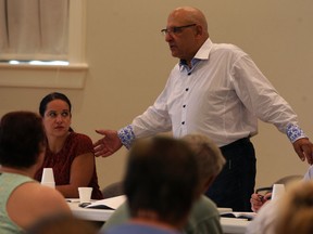 On Aug. 27, 2013, Harvey Strosberg of Sutts, Strosberg LLP, right, and his daughter Sharon Strosberg, met with a group of residents to discuss their lawsuit against the Canadian Transit Company. The lawyers are filing another lawsuit against the CTC with a different group of residents. (NICK BRANCACCIO/The Windsor Star)