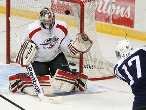 Windsor's Brady Vail, right, takes a shot on goalie Jordan DeKort during the first day of training camp at the WFCU Centre Monday. (TYLER BROWNBRIDGE/The Windsor Star)