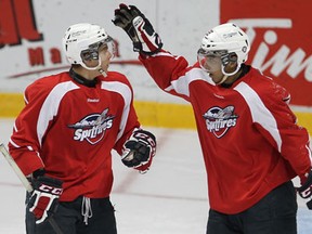 Spits forward Ben Johnson, left, and Josh Ho-Sang celebrate a goal during training camp Wednesday at the WFCU Centre. (DAN JANISSE/The Windsor Star)