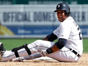 Detroit's Miguel Cabrera grabs his leg after being tagged out sliding into second base against the Oakland Athletics in the fifth inning at Comerica Park Thursday. (AP Photo/Paul Sancya)