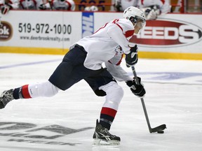 Windsor forward Ryan Foss leans into a shot and scores against Eli Billing of Team Blue Thursday at the WFCU Centre. (NICK BRANCACCIO/The Windsor Star)