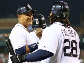 Detroit's Miguel Cabrera, left, celebrates with teammate Prince Fielder after hitting a two-run homer against the Oakland Athletics at Comerica Park. (Photo by Leon Halip/Getty Images)