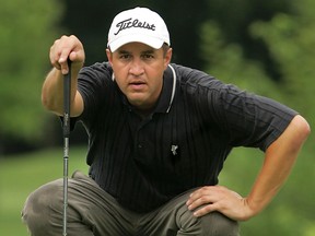 Mike Altenhof lines up a putt at Essex Golf & Country Club in 2006. (Star file photo)