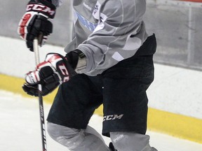 Windsor Spitfires forward Remy Giftopoulos passed the puck during practice at the WFCU community rink. (NICK BRANCACCIO/The Windsor Star)