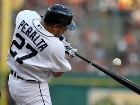 Detroit's Jhonny Peralta makes contact on an inside pitch against the Los Angeles Angels at Comerica Park. (Photo by Dave Reginek/Getty Images)