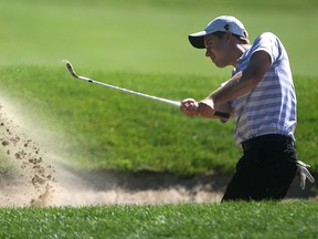 LaSalle's Doug Hoppe hits a bunker shot on the eighth hole of the Western Ontario Amateur Championship at Seven Lakes. (DAX MELMER/The Windsor Star)