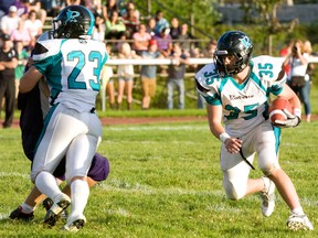 Essex Ravens running back Elijah Fera, right, has a clear path to run during an OVFL playoff game against the London Mustangs in Essex on Aug. 4, 2013. (JOEL BOYCE/The Windsor Star)