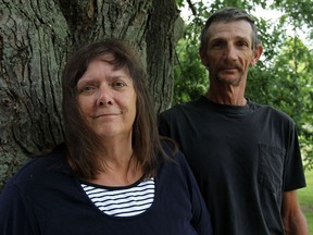 Terry and Debbie Lauzon are photographed at their home near Wheatley on Wednesday, August 14, 2013. The couple have both been waiting to see a neurosurgeon to deal with on going back problems.              (TYLER BROWNBRIDGE/The Windsor Star)