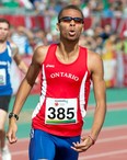 Windsor's Brandon McBride reacts as he crosses the finish line to win the gold medal in the men's 400-metre race at the Canada Summer Games Thursday, August 15, 2013 in Sherbrooke, Quebec. THE CANADIAN PRESS/Paul Chiasson