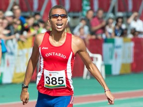 Windsor's Brandon McBride crosses the finish line to win the gold medal in the men's 400-metre race at the Canada Games Thursday, August 15, 2013 in Sherbrooke, Quebec. McBride won his second gold Friday. THE CANADIAN PRESS/Paul Chiasson