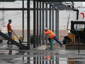 Construction workers were busy at a site on the southeast corner of Tecumseh and Walker roads Aug. 13, 2013.  (DAX MELMER/The Windsor Star)