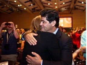 Jerry Dias hugs his wife Leslie after being declared the first president of Unifor at the Unifor founding convention in Toronto, Saturday, Aug. 31, 2013. Dias, assistant to CAW national president Ken Lewenza, was chosen Saturday to lead Unifor, a merger of the CAW and the Communications, Energy and Paperworkers Union of Canada. THE CANADIAN PRESS/Galit Rodan