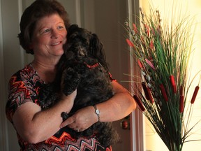 Marlene Roy and her dog Missy at her Windsor home on August 7, 2013. Roy received diluted chemo treatment for her cancer. (Jason Kryk/The Windsor Star)