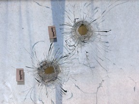 WINDSOR, ONT. AUGUST 30, 2013.: Bullet holes are shown Friday, Aug. 30, 2013, in an apartment window at 325 Gilles Blvd. W. An early morning drive-by shooting caused the damage. (DAN JANISSE/The Windsor Star)