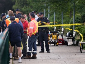 Emergency personnel prepare to pull a dead man from the Detroit River, Wednesday, Aug. 14, 2013, near Riverside Dr. and Church St.   (DAN JANISSE/The Windsor Star)