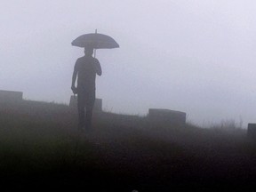 Make sure to get outside, even in inclement weather. Getting outside in bad weather boosts mood more than an indoor workout. (BIJU BORO / AFP / Getty Images files)