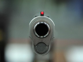 A view down the barrel of a .45-calibre handgun is shown in this May 2013 file photo. (Karen Bleier / AFP / Getty Images)