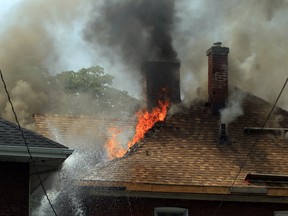 Flames shoot through the roof at a house fire in the 800 block of Howard Avenue on August 19, 2013.  (JASON KRYK/The Windsor Star)