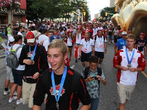 Athletes from around the world parade before the closing of the International Children's Games on Sunday.  (DAX MELMER/The Windsor Star)