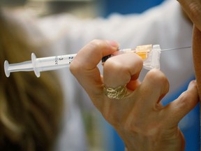 A vaccine is administered in this file photo. (JOE RAEDLE / Getty Images files)