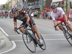 Cyclists compete in the elite/professional race at the Tour di Via Italia on Erie Street, Sunday, Sept. 2, 2012.  Here cyclists make the turn at the corner of Erie Street and Parent Avenue.  (DAX MELMER/The Windsor Star)